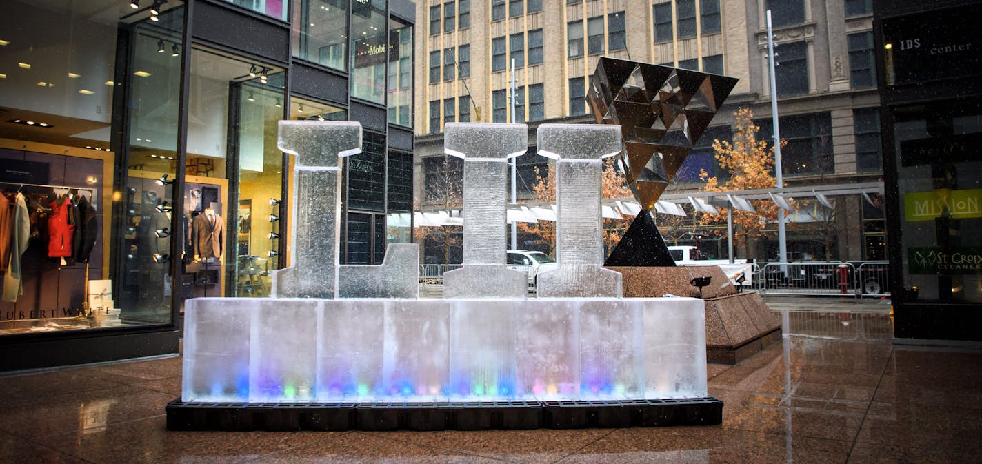 A Superbowl LII ice sculpture outside the IDS Crystal Court 100 days before the Super Bowl .