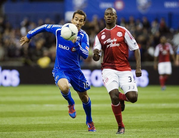 Montreal Impact's Eduardo Sebrango, left, and Portland Timbers' Hanyer Mosquera chase down the ball during the second half of their MLS soccer match i