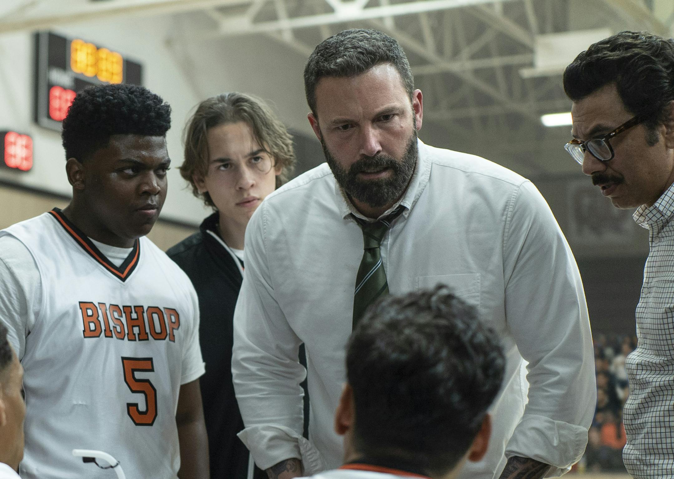 This image released by Warner Bros. Pictures shows Charles Lott Jr., left, Ben Affleck and Al Madrigal in a scene from "The Way Back." (Richard Foreman/Warner Bros. Pictures via AP)