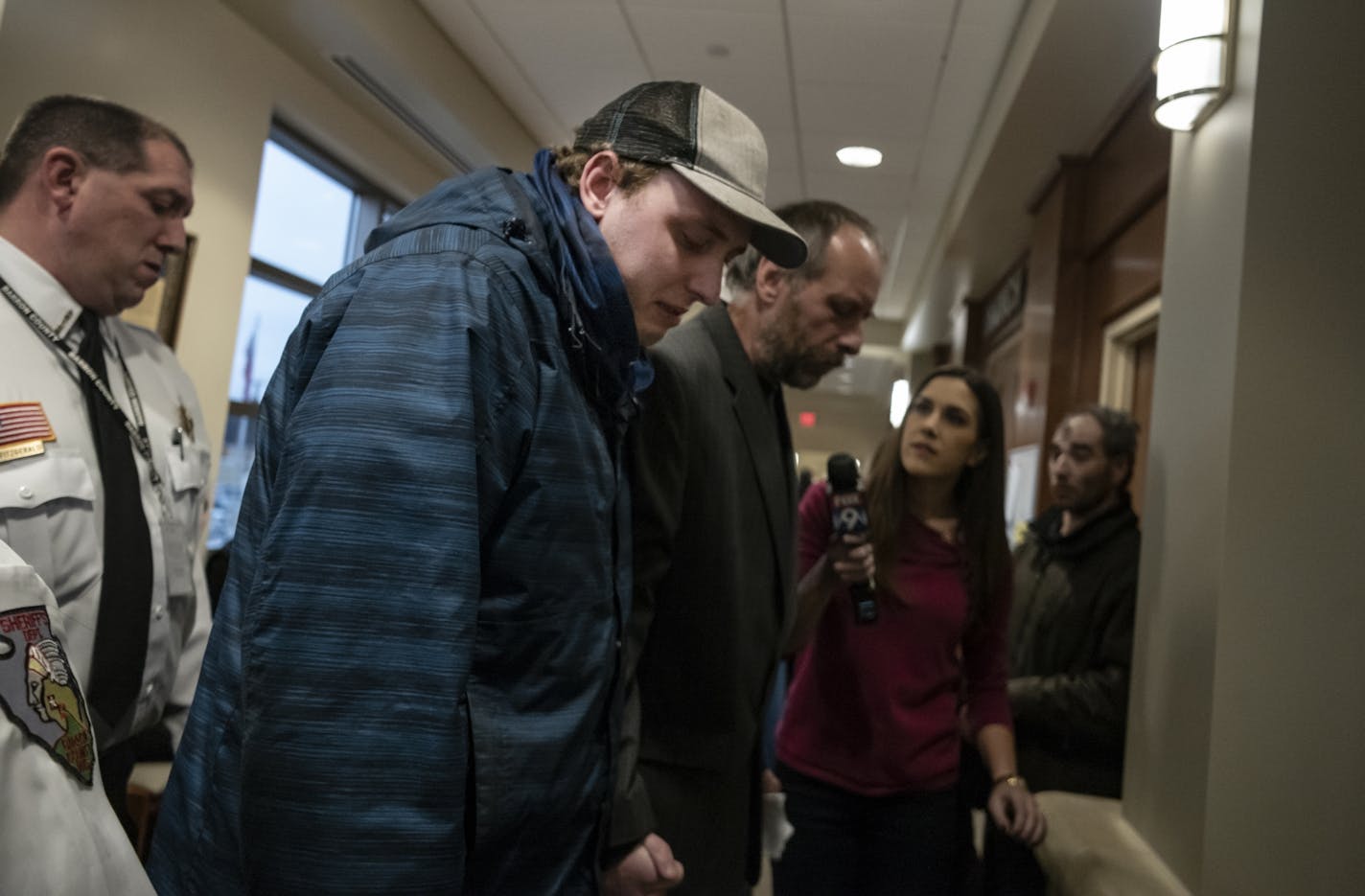 Defense attorney Richard Jones talks to Jake Paterson's father Patrick and brother Erik. Jake Paterson, the alleged kidnapper of Jayme Closs made his first court appearance in court with Judge James C Babler presiding today in Barron, Wisconsin.