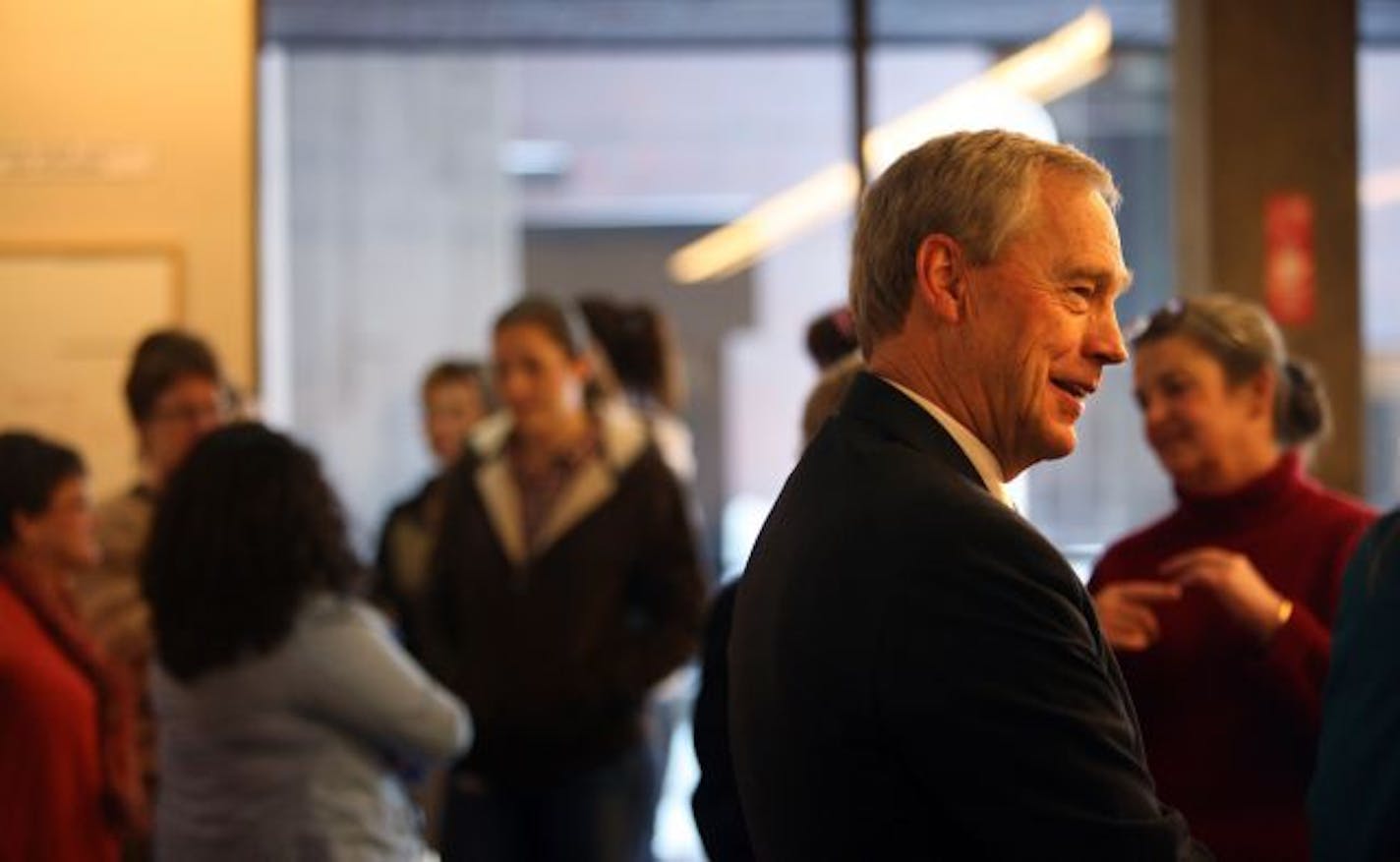 Judge Robert Carolan, former Dakota County district court judge, greeted a long line of colleagues saying goodbye as he retires. Carolan has served as an international judge of war crimes. He will return to Kosovo to help local judges write rules of law for the young nation.