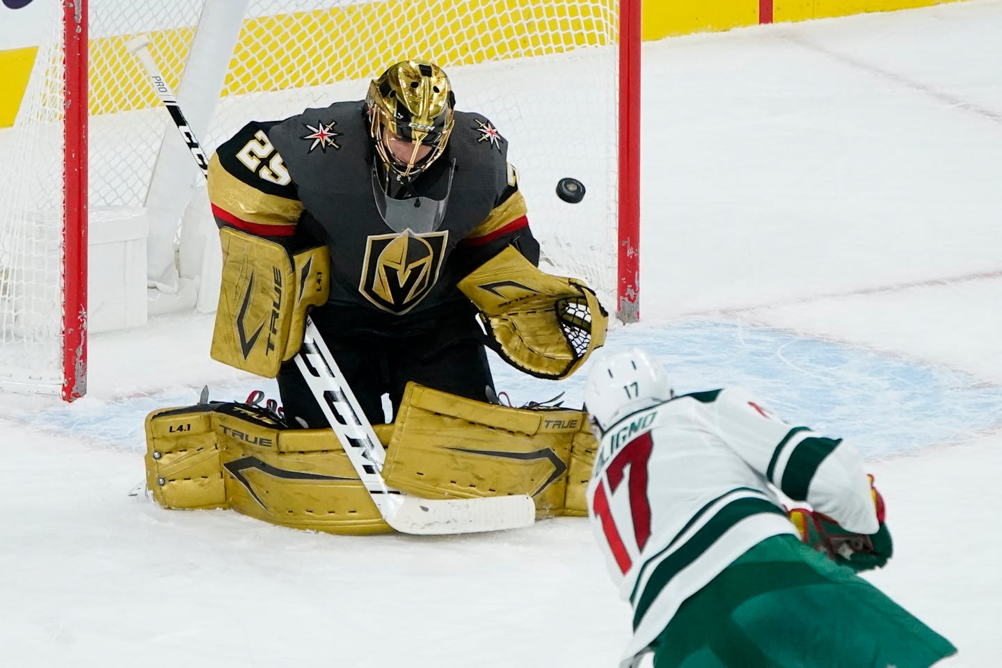 Minnesota Wild left wing Marcus Foligno (17) scores on Vegas Golden Knights goaltender Marc-Andre Fleury (29) during the second period of an NHL hockey game Monday, March 1, 2021, in Las Vegas. (AP Photo/John Locher)