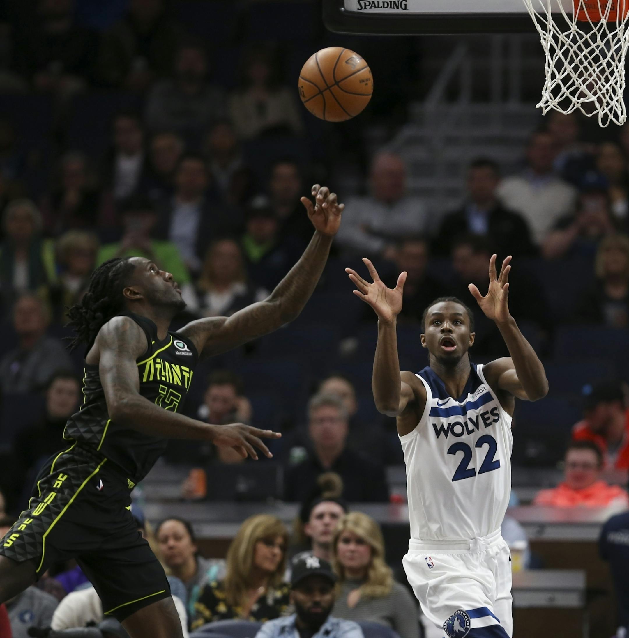 Minnesota Timberwolves forward Andrew Wiggins (22) eyed a second quarter pass as did Atlanta Hawks forward Taurean Prince (12).