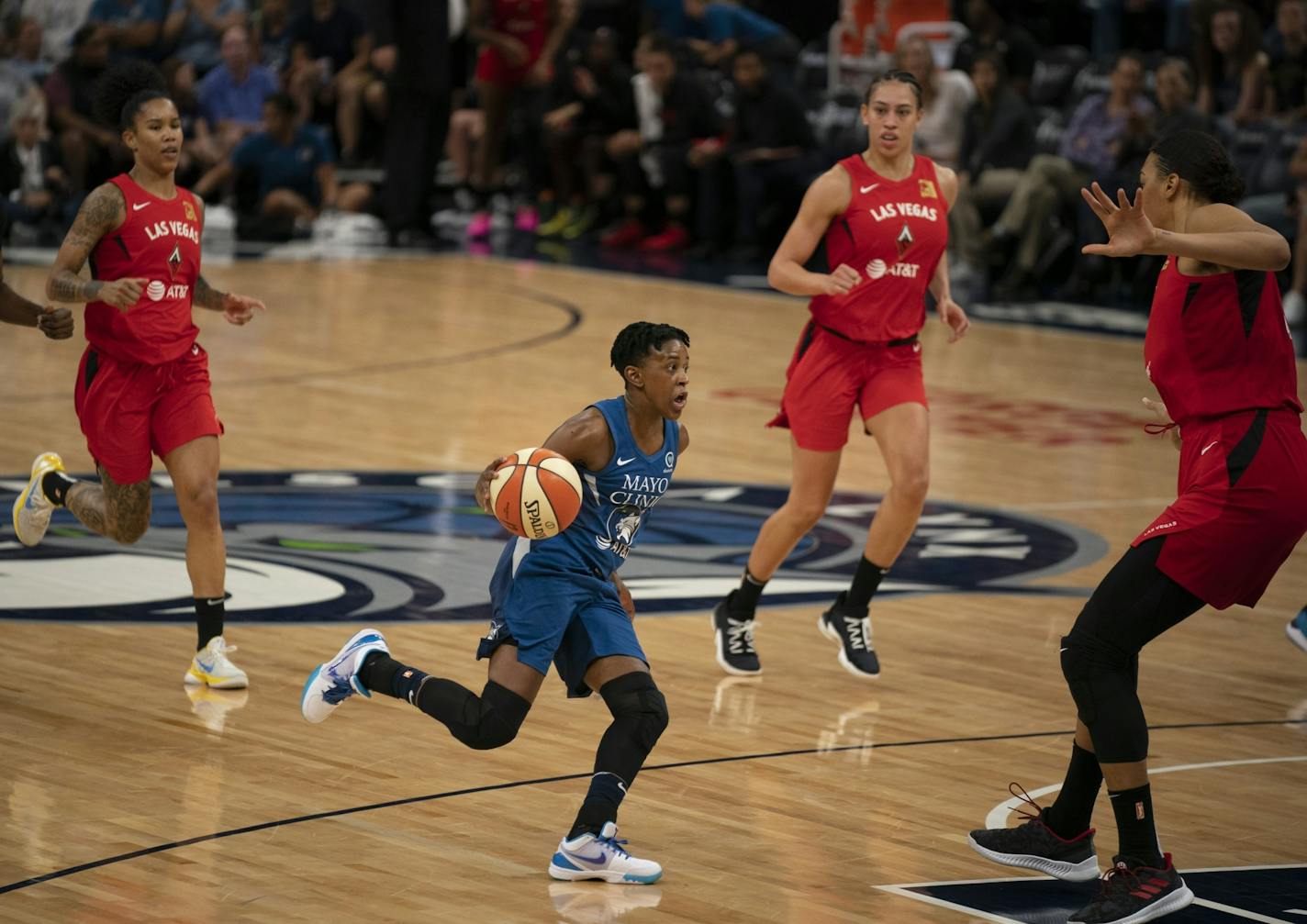 Danielle Robinson (3) drove the ball up court against Las Vegas Aces center Liz Cambage (8) on Sunday.