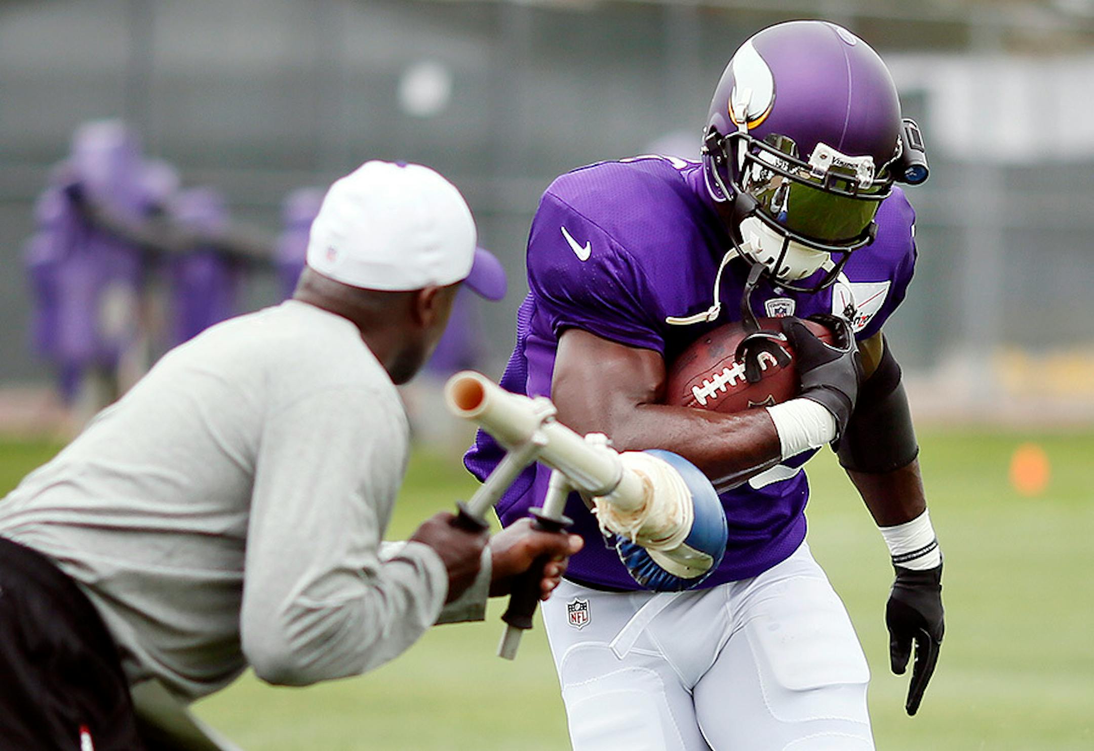 Adrian Peterson ran through a fumble drill during Vikings training camp at Minnesota State University Mankato.