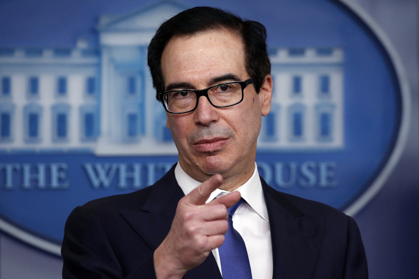 Treasury Secretary Steven Mnuchin speaks about the coronavirus in the James Brady Press Briefing Room at the White House, Monday, April 13, 2020, in Washington. (AP Photo/Alex Brandon) ORG XMIT: MERd1df407e74337bade4fbe45cb5a91