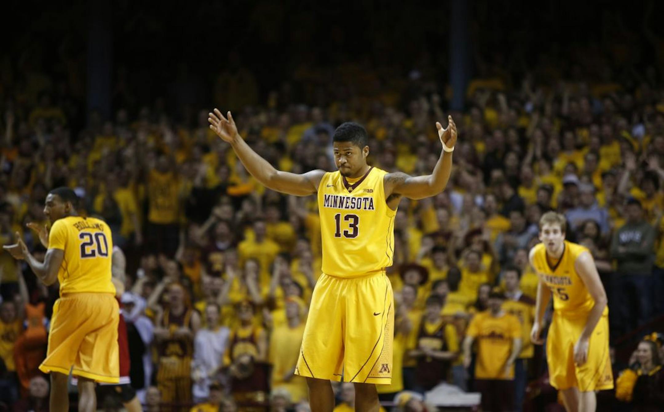 Maverick Ahanmisi waved his arms for more crowd noise after scoring against Indiana