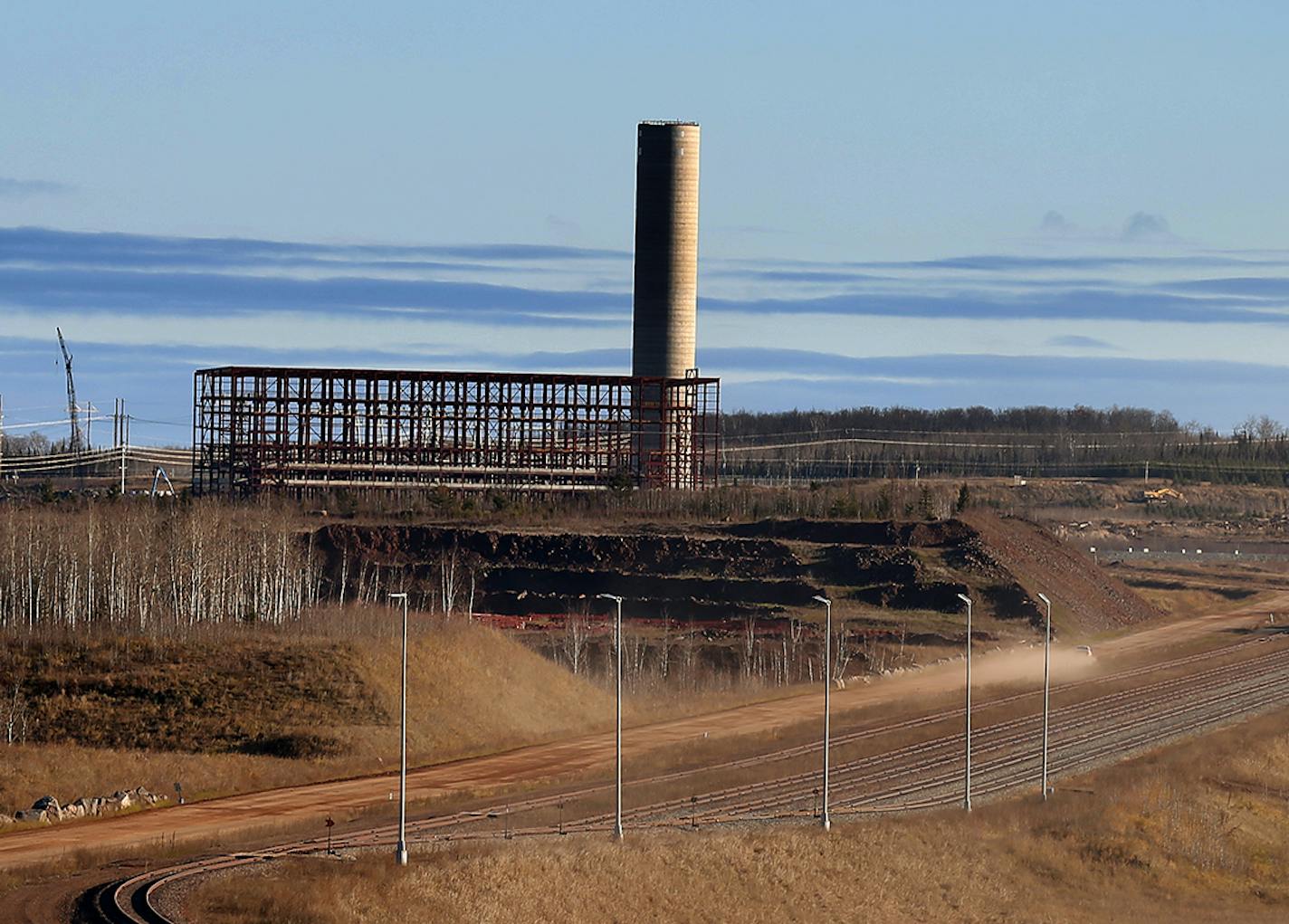 The stacks and the steel frame for the induration building are seen on the site of Essar Steel Minnesota's taconite mine project in Nashwauk, Minn. ] LEILA NAVIDI leila.navidi@startribune.com / BACKGROUND INFORMATION: Friday, October 31, 2014. Essar Steel Minnesota recently ramped up construction on an $1.8 billion taconite plant after securing the funding needed to complete the project. The plant endured several delays over the past two years as funds periodically ran dry and some contractors w