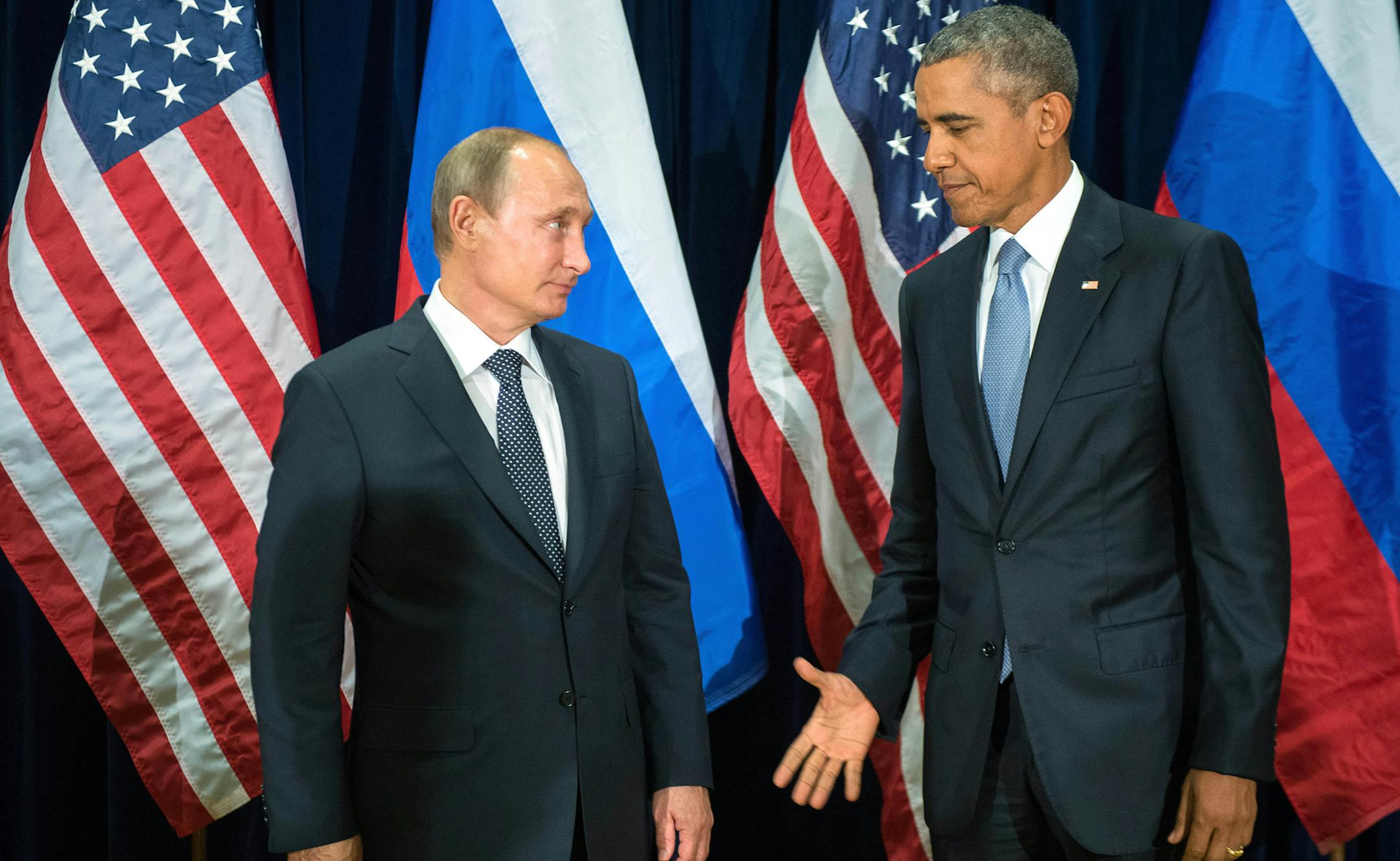 FILE - In this Monday, Sept. 28, 2015 file photo, U.S. President Barack Obama, right, and Russia's President Vladimir Putin pose for members of the media before a bilateral meeting at the United Nations headquarters. (Sergey Guneyev/RIA-Novosti, Kremlin Pool Photo via AP) ORG XMIT: NYPS101 ORG XMIT: MIN1706231618290407
