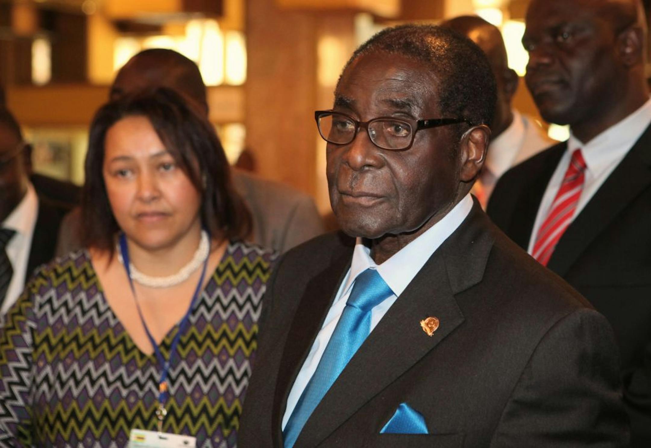 Zimbabwean President Robert Mugabe, right, attends the 20th anniversary of the African Capacity Building Foundation (ACBF) in Harare, Wednesday, Feb. 8, 2012.