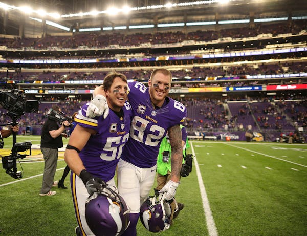 Vikings outside linebacker Chad Greenway, left, and tight end Kyle Rudolph ran off the field together after the Vikings win.