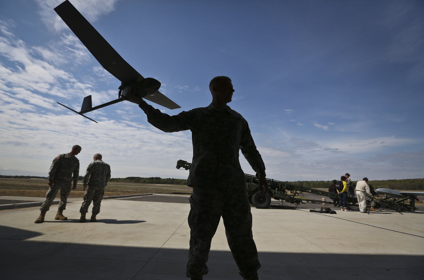 Sgt. Christopher Storkamp held a Raven unmanned aircraft with a camera that can be carried in a backpack and hand launched to scope out potentially dangers situations. Sgt. Storkamp is a Raven master trainer and was part of the grand opening of the Camp Ripley Unmanned Aircraft Systems Operations Facility in Little Falls, Minn., on Friday, May 16, 2013. ] (RENEE JONES SCHNEIDER * reneejones@startribune.com)