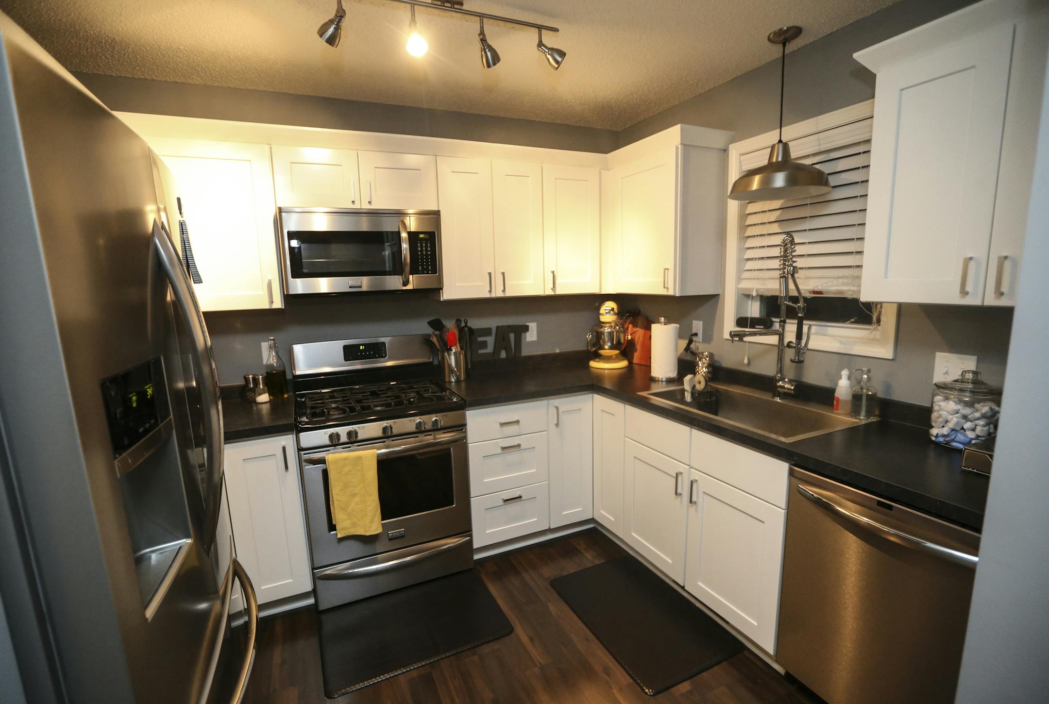 Missi and Tyler Franz's kitchen in their new home in Columbia Heights, Minn. ] RENÉE JONES SCHNEIDER reneejones@startribune.com The city of Columbia Heights bought some of the ugliest, skankiest houses in the city. They tore them down and built new, sleek 1200 sq ft two stories designed for those conflicted young homebuyers torn between the city and the suburbs .Photographs taken on Tuesday, December 23, 2014, in Columbia Heights, Minn.