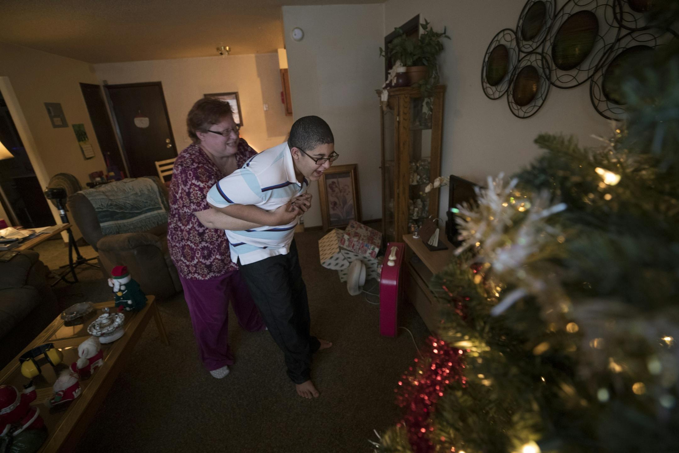 Cora Mustin played with her15-year-old son Jordan Mustin in their apartment after he arrived home from school Thursday December 14, 2017 in Mounds View, MN. Jordan has autism and a history of violent outbursts toward himself and family.