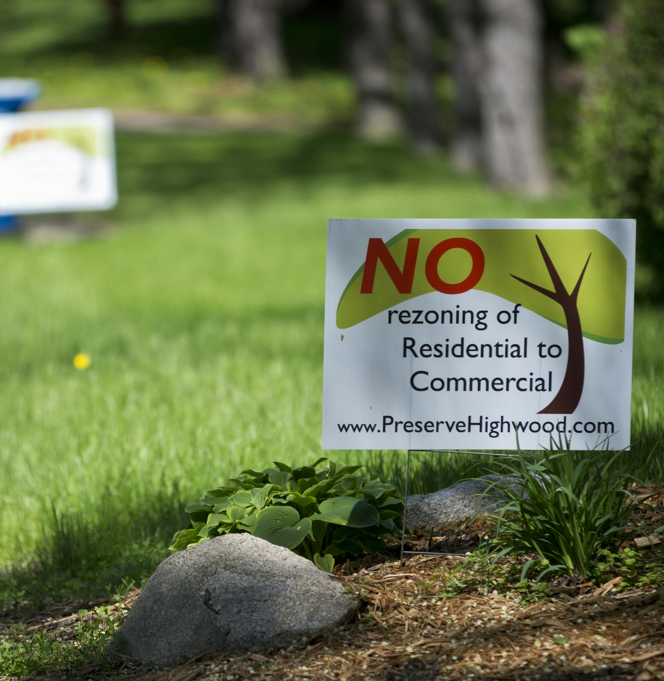 Neighbors protested with signs the a proposed project (15417 Highwood Drive) that will take out four houses and three commercial properties to build medical building. Photographed on Friday, May 31, 2013, Minnetonka, Minn. ] (RENEE JONES SCHNEIDER * reneejones@startribune.com)