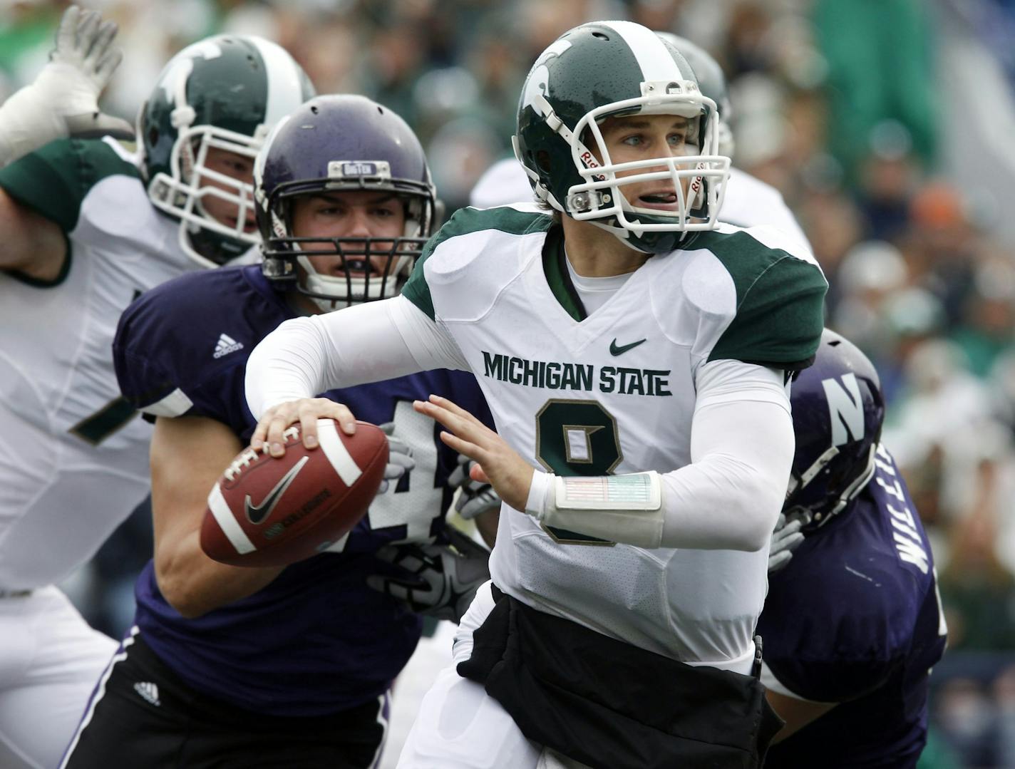 Michigan State quarterback Kirk Cousins looks to a pass during the first quarter of an NCAA college football game against Northwestern, Saturday, Oct. 23, 2010, in Evanston, Ill.(AP Photo/Nam Y. Huh)