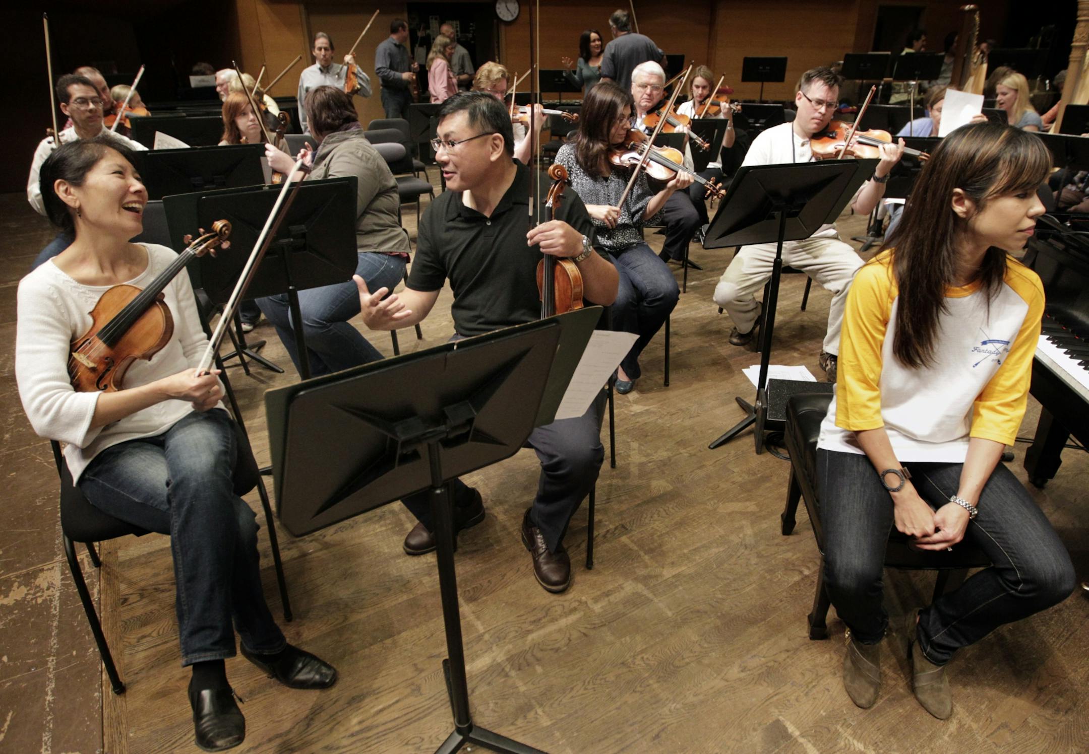 At left, Concert Master Sarah Kwak.