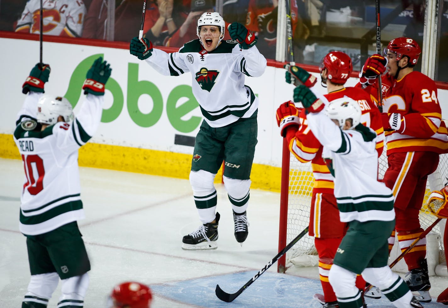 The Wild's Matt Read, left, celebrates his goal with teammates during the third period Saturday.