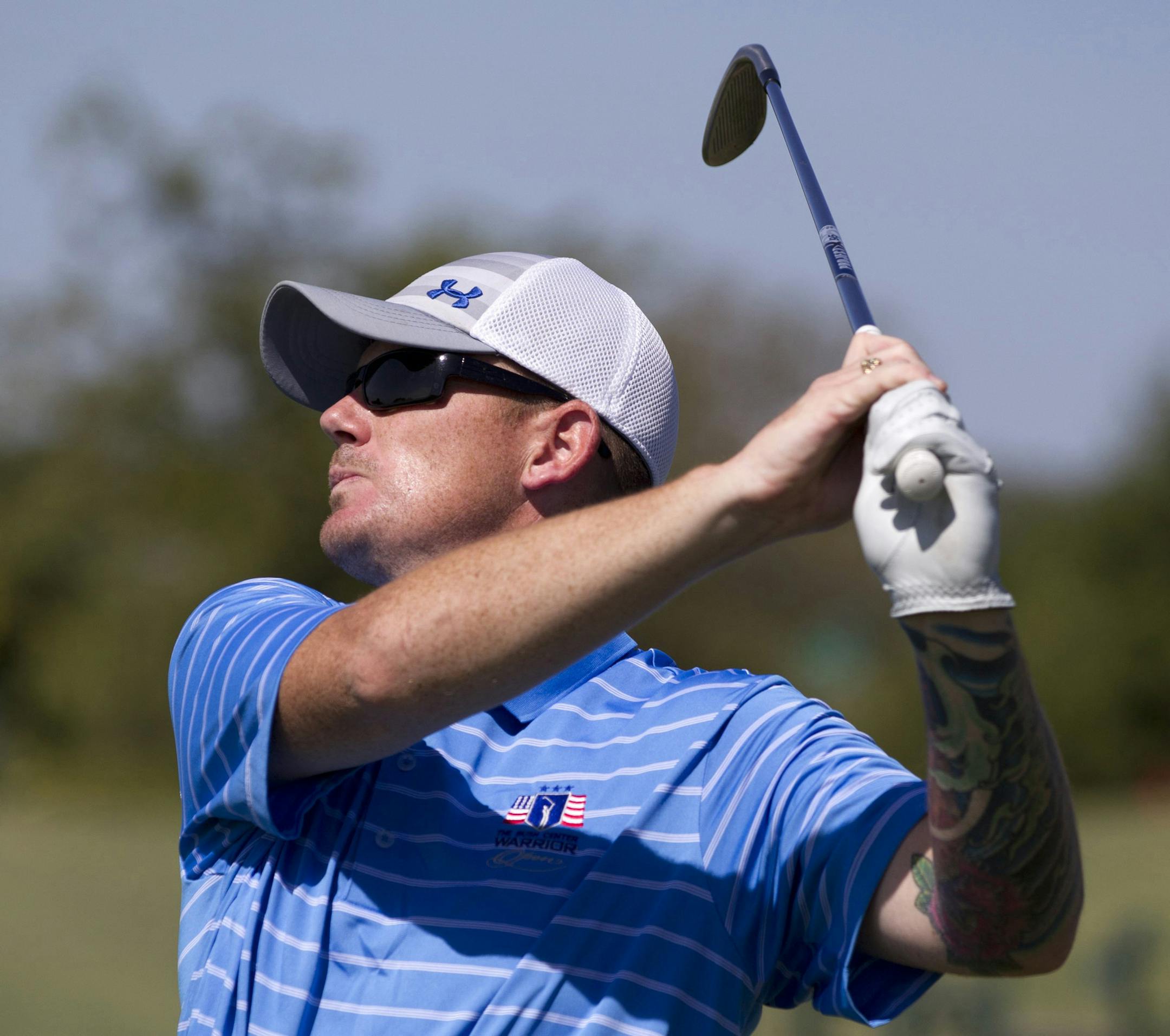 Andrew Bachelder practices at Leonard Golf Links in Fort Worth, Texas, on Monday, Aug. 10, 2015. Bachelder is still recovering from a mid-air helicopter collision in Afghanistan that left him with many broken bones. He will play golf with former President George W. Bush in his annual Warrior Open tournament for military members seriously injured since Sept. 11, 2001. (Joyce Marshall/Fort Worth Star-Telegram/TNS)