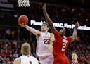 Wisconsin's Ethan Happ (22) shoots against Rutgers' Shaquille Doorson (2) during the second half of an NCAA college basketball game Monday, Dec. 3, 20