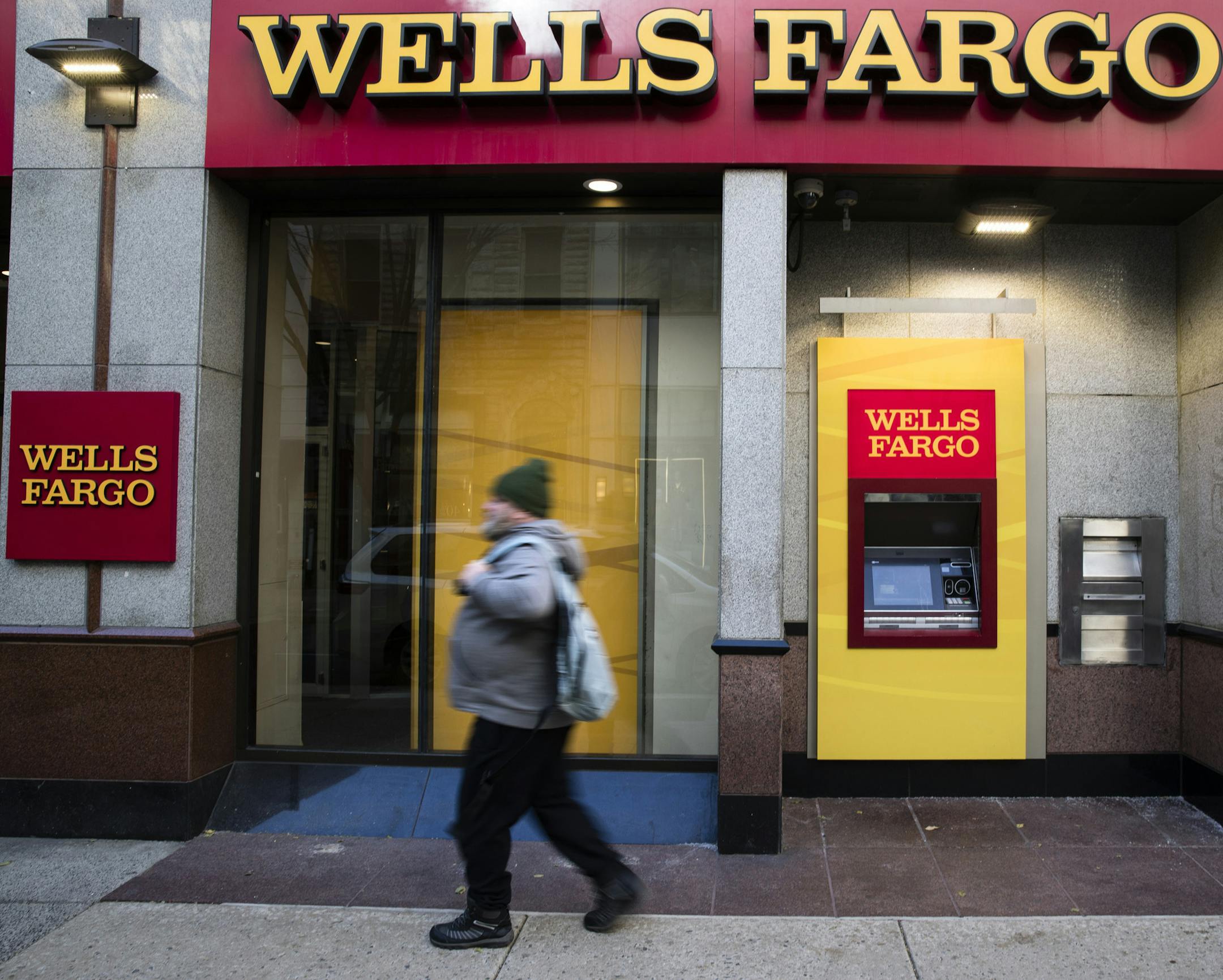FILE- This Nov. 29, 2018, file photo shows a Wells Fargo bank location in Philadelphia. Wells Fargo customers are experiencing issues with accessing online or mobile banking as well as other banking services, after a fire happened at one of the bank’s data centers. (AP Photo/Matt Rourke, File) ORG XMIT: NYBZ448