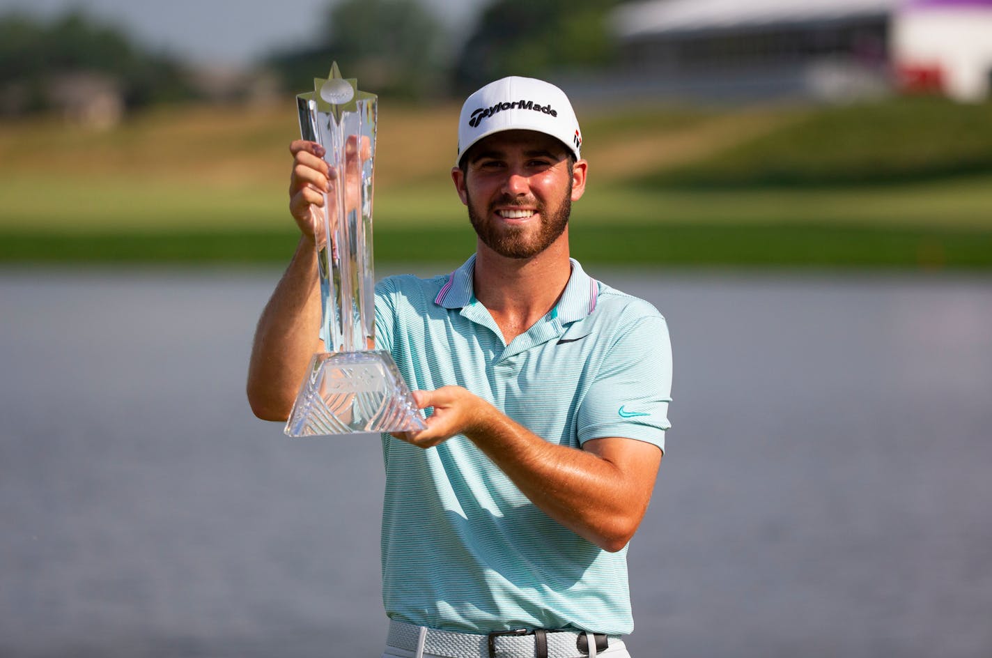 Matthew Wolff poses with the 3M Open trophy after winning the event last July at TPC Twin Cities in Blaine.