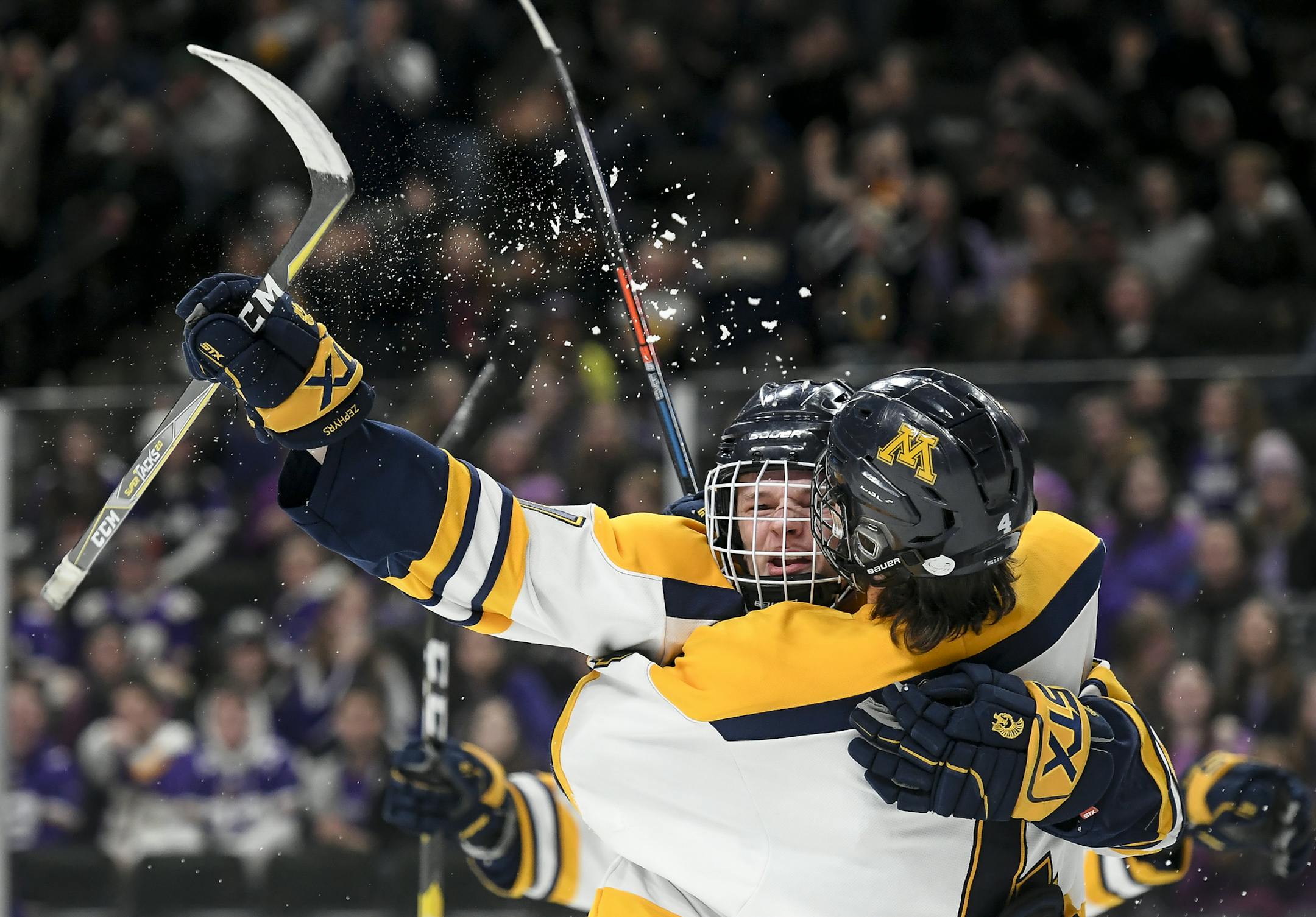 Mahtomedi forward Colin Hagstrom (4) celebrated with defenseman JD Metz (11) after Metz scored his first of two goals in the first period against New Ulm. ] Aaron Lavinsky ¥ aaron.lavinsky@startribune.com New Ulm played Mahtomedi in a Class 1A quarterfinal hockey game on Wednesday, March 6, 2019 at the Xcel Energy Center in St. Paul, Minn.