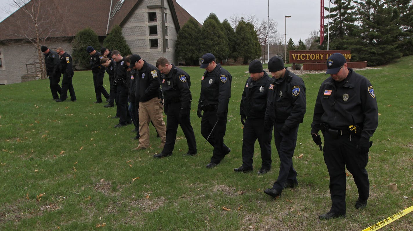 Officers from Eden Prairie and from several other jurisdictions walked shoulder to shoulder searching the grounds of Victory Lutheran Church on Saturday.