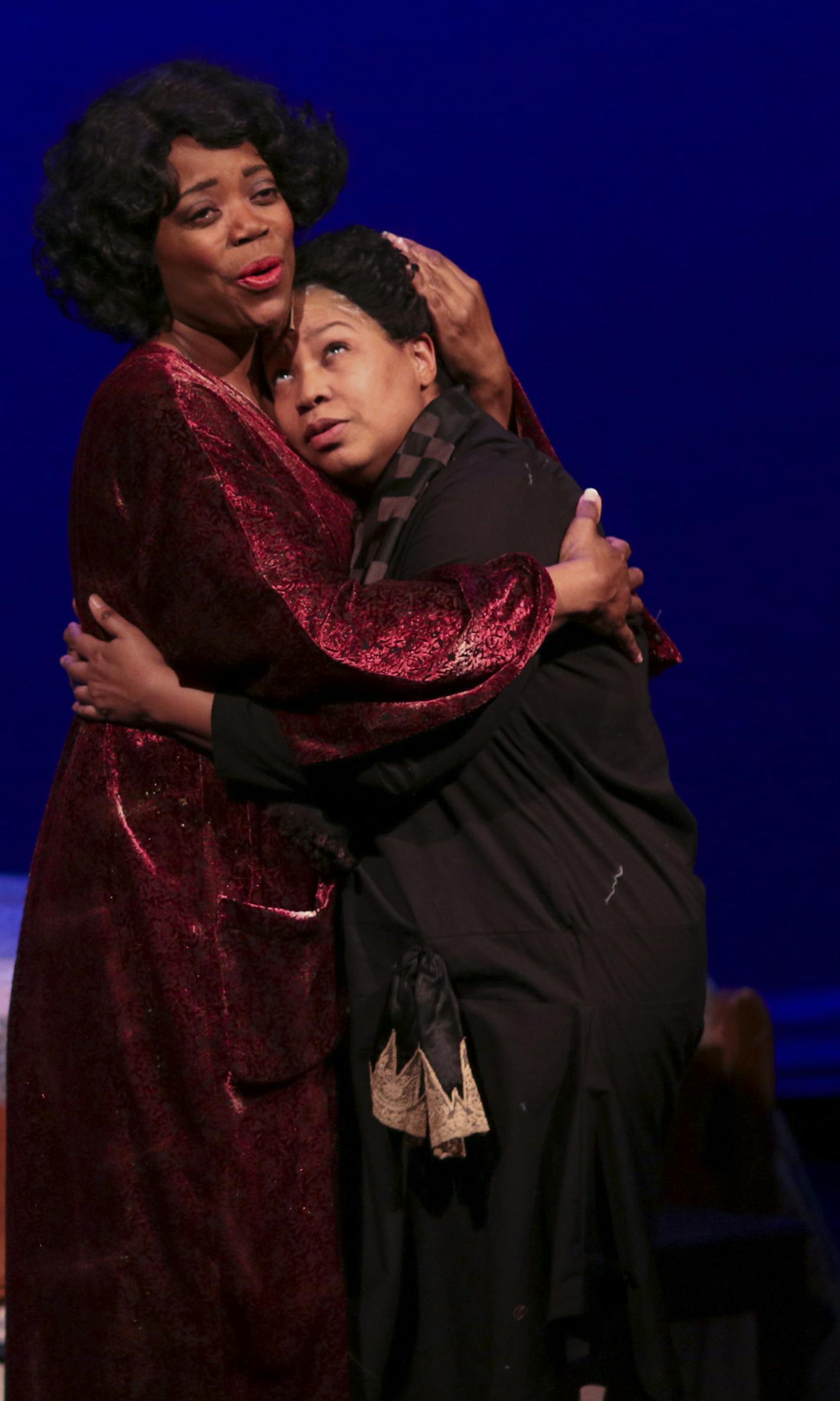 Regina Marie Williams, left, as Shug Avery held Aimee K. Bryant as Celie she sang in the first act during rehearsal for "The Color Purple." ] JEFF WHEELER &#x201a;&#xc4;&#xa2; jeff.wheeler@startribune.com Park Square Theatre in St. Paul is staging the regional premiere of "The Color Purple." The cast rehearsed Wednesday night, January 14, 2014.