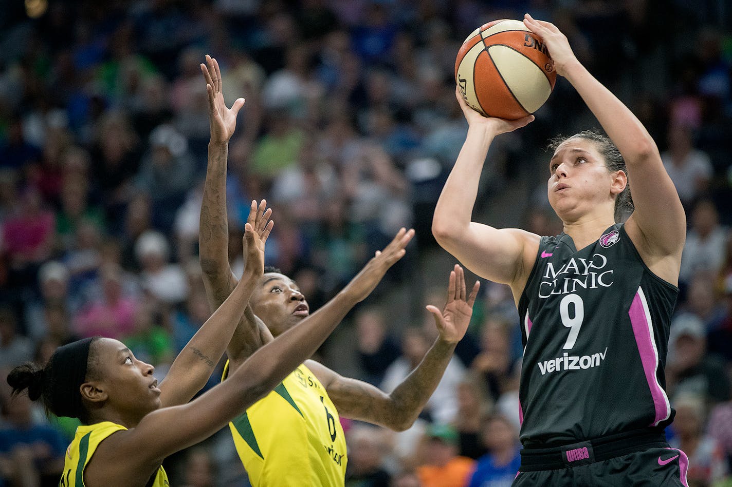 Seattle Storm's guard Jewell Loyd, left, and forward Natasha Howard stopped Minnesota Lynx forward Cecilia Zandalasini under the net during the third period as the Minnesota Lynx took on the Seattle Storm, at Target Center, Sunday, August 12, 2018 in Minneapolis, MN. ] ELIZABETH FLORES • liz.flores@startribune.com