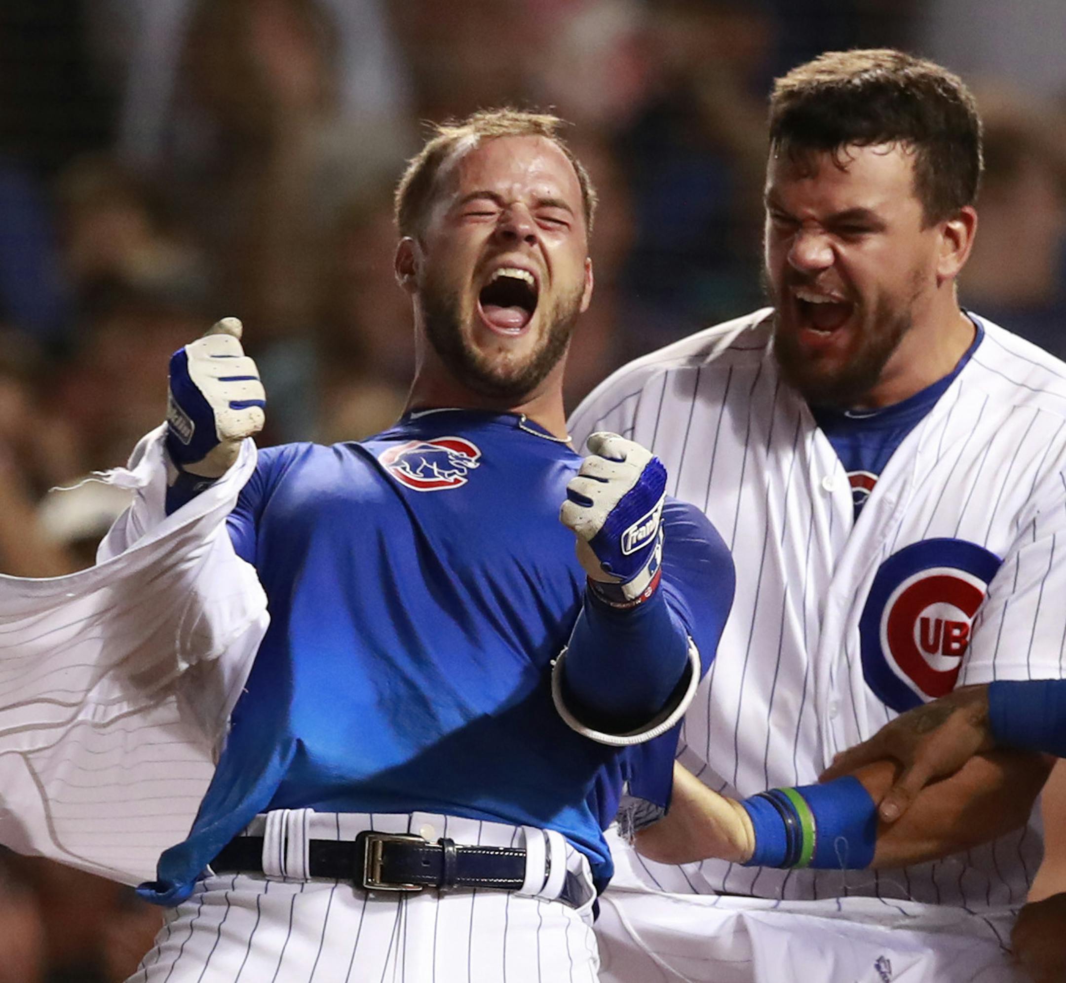 Chicago Cubs third baseman David Bote (13) celebrates after hitting his grand slam to win the game in the bottom off the ninth inning against the Washington Nationals on Sunday, Aug. 12, 2018 at Wrigley Field in Chicago, Ill. (Nuccio DiNuzzo/Chicago Tribune/TNS)