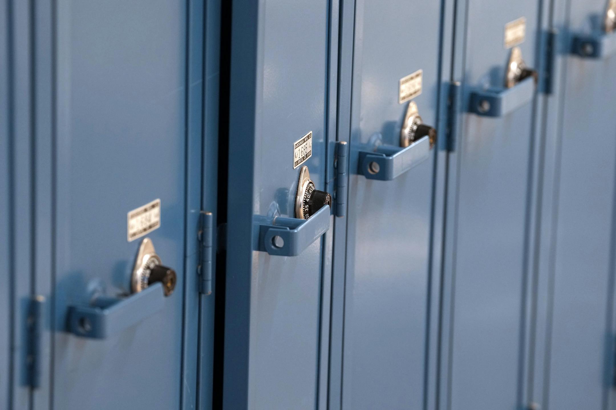 Row of blue unused blue lockers at Wayzata High School.