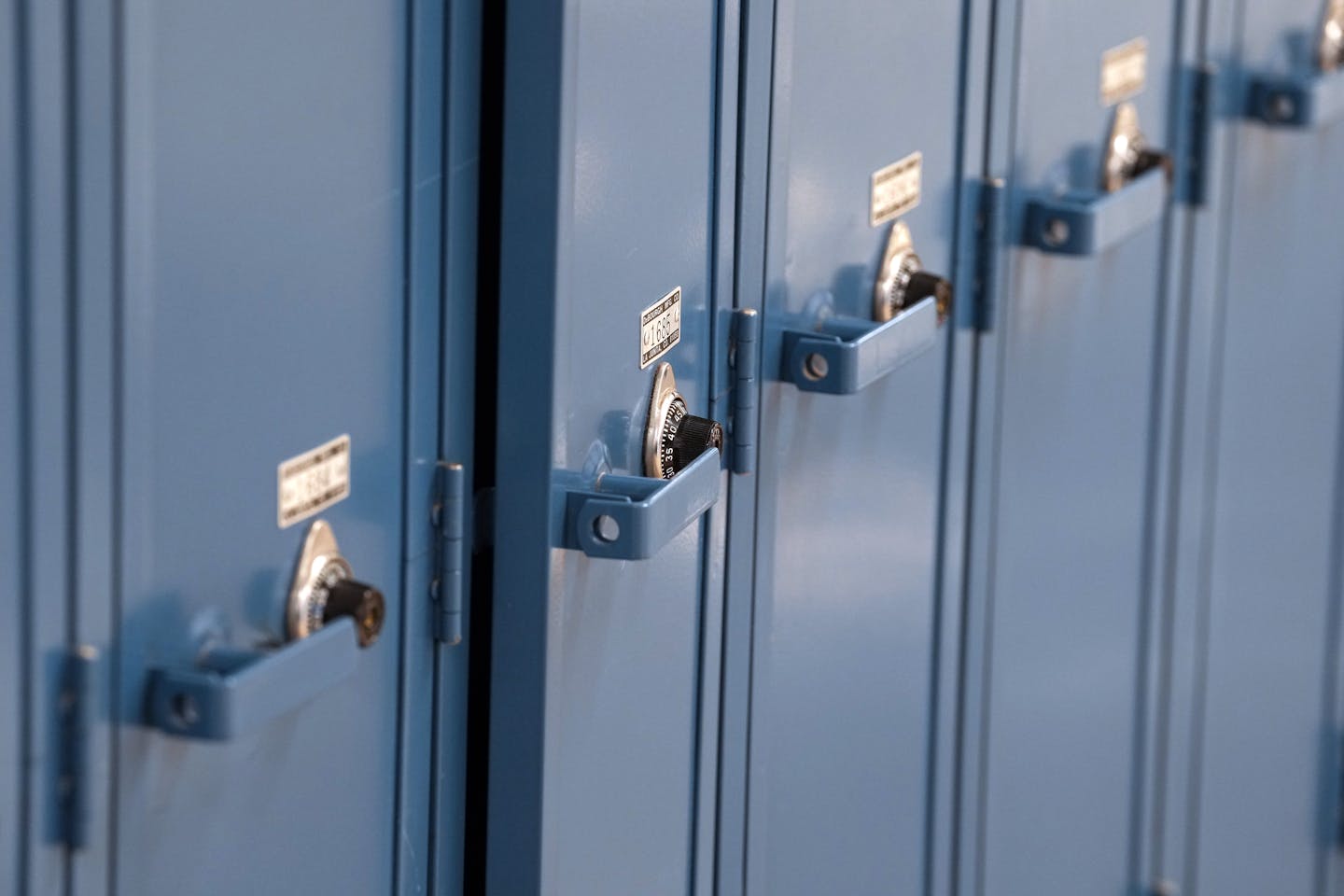 Row of blue unused blue lockers at Wayzata High School.