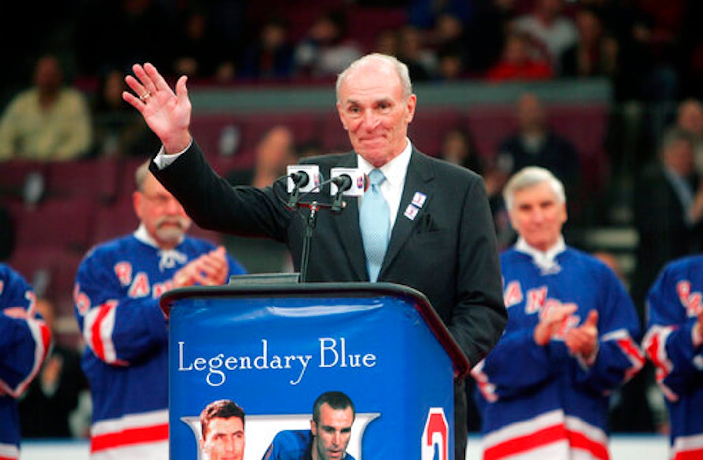 FILE - In this Sunday, Feb. 22, 2009 file photo, Harry Howell waves to the crowd during a ceremony to retire his number before the Ranger's hockey game at Madison Square Garden in New York. NHL Hall of Fame defenseman Harry Howell, who played the most games in the history of New York Rangers, has died. He was 86. Howell died Saturday night, March 9, 2019. Howell played 1,160 games for the Rangers from 1952-69 and had his No. 3 retired by the team. (AP Photo/Seth Wenig, File)