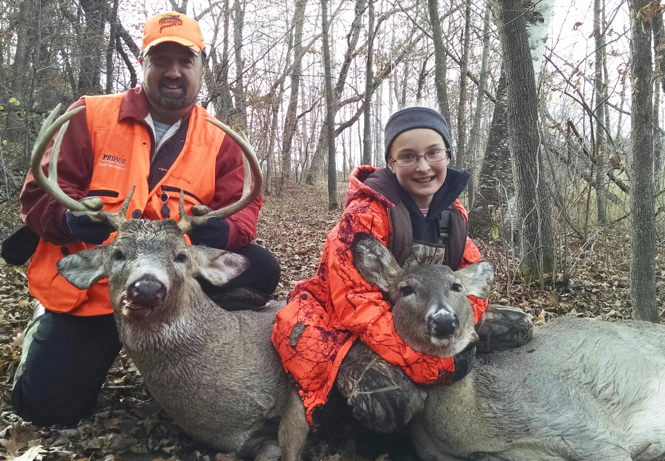 Jason Pommier, and daughter, Heather, 10, of North Branch, with deer they bagged Sunday. It was Heather's first whitetail.