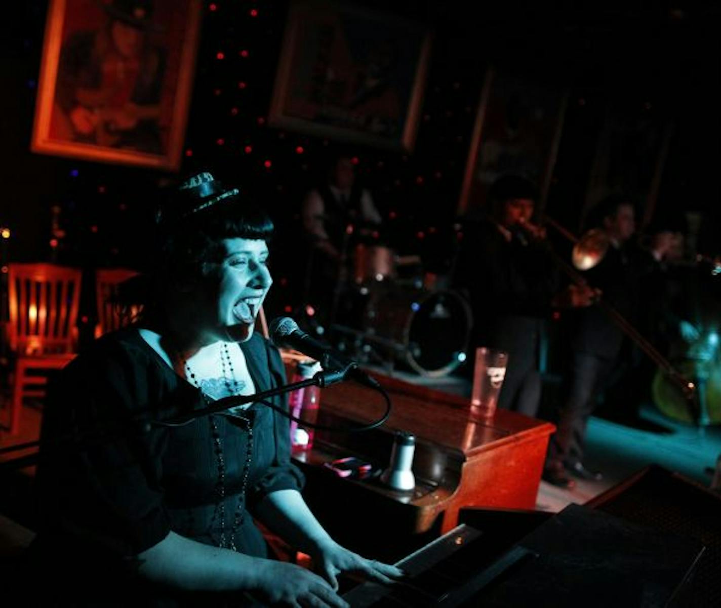 At Famous Dave's Uptown location, lead singer Davina Sauer of Davina and the Vagabonds belted away on the electronic keyboard as Valentine dates swing danced.