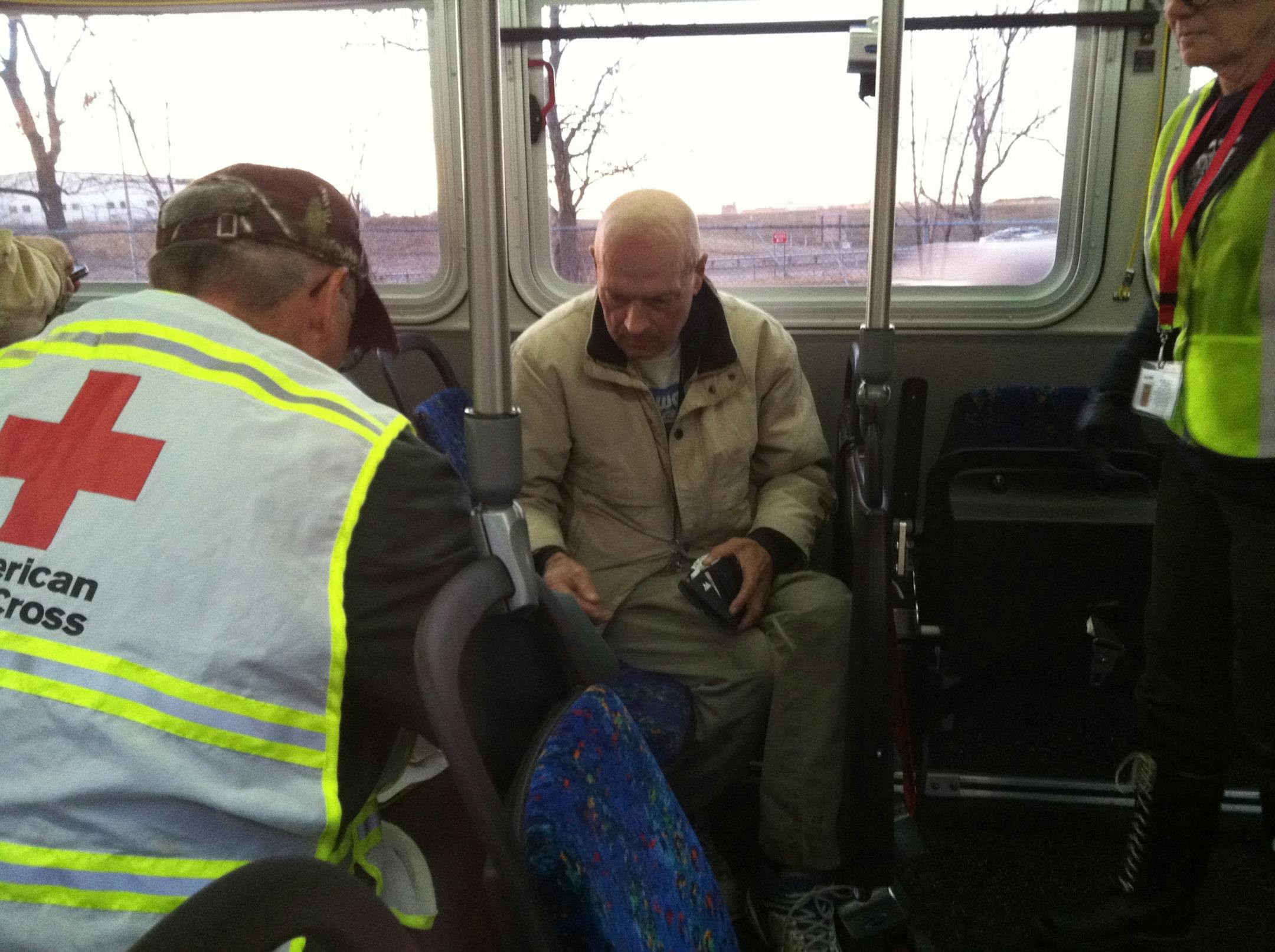 Apartment resident Gale Sweeney talks with Red Cross workers after a fire at the apartment building where he lived at 5760 33 Ave South, in Minneapolis.