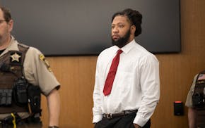 Derrick Thompson walks into court Tuesday during his criminal trial at the Hennepin County Courthouse.