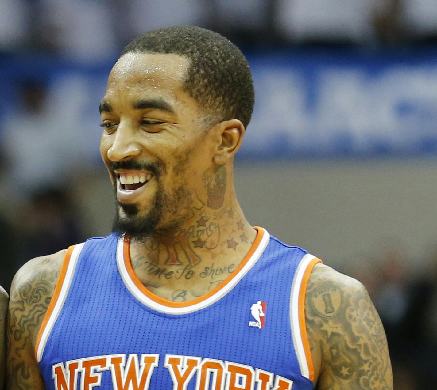 New York Knicks guards Iman Shumpert (21) and J.R. Smith (8) smiles as they walk toward the bench after a timeout was called during the second half of an NBA basketball game, Sunday, Jan. 5, 2014, in Dallas. The Knicks won 92-80. (AP Photo/Sharon Ellman)