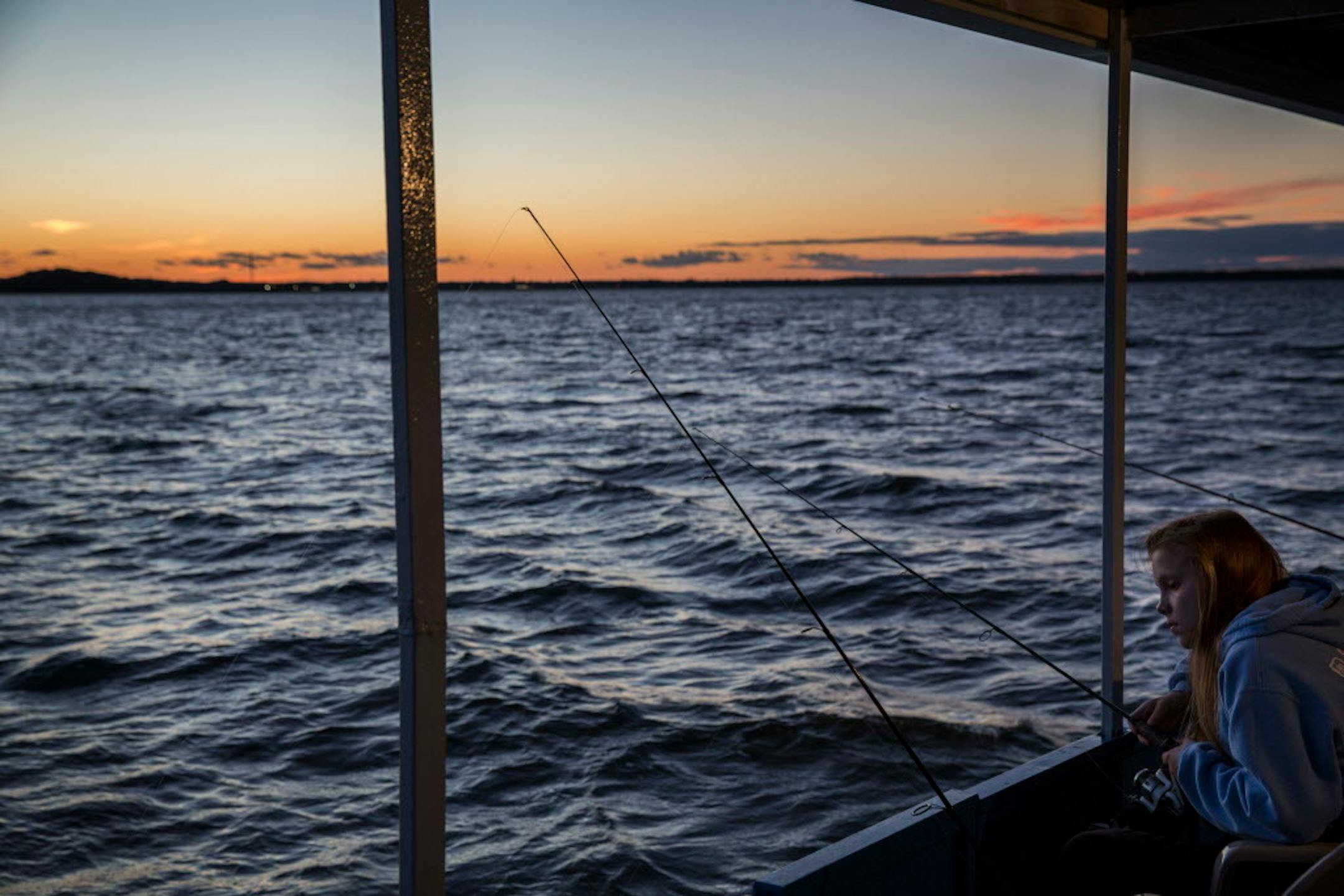 Emily Biondo, 17, of Chicago looks for fish during a fishing expedition with Twin Pines Resort on Mille Lacs Lake Monday, August 3, 2015. ] LEILA NAVIDI leila.navidi@startribune.com /