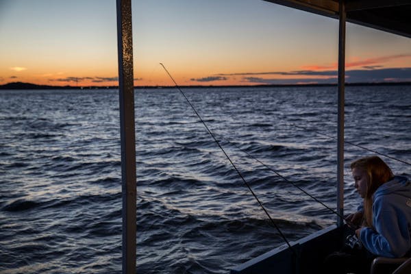 Emily Biondo, 17, of Chicago looks for fish during a fishing expedition with Twin Pines Resort on Mille Lacs Lake Monday, August 3, 2015. ] LEILA NAVI