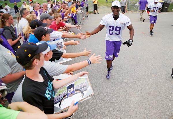 Vikings cornerback Xavier Rhodes slapped hands with fans at Vikings training camp. The Vikings are talking with MSU Mankato to extend their agreement 