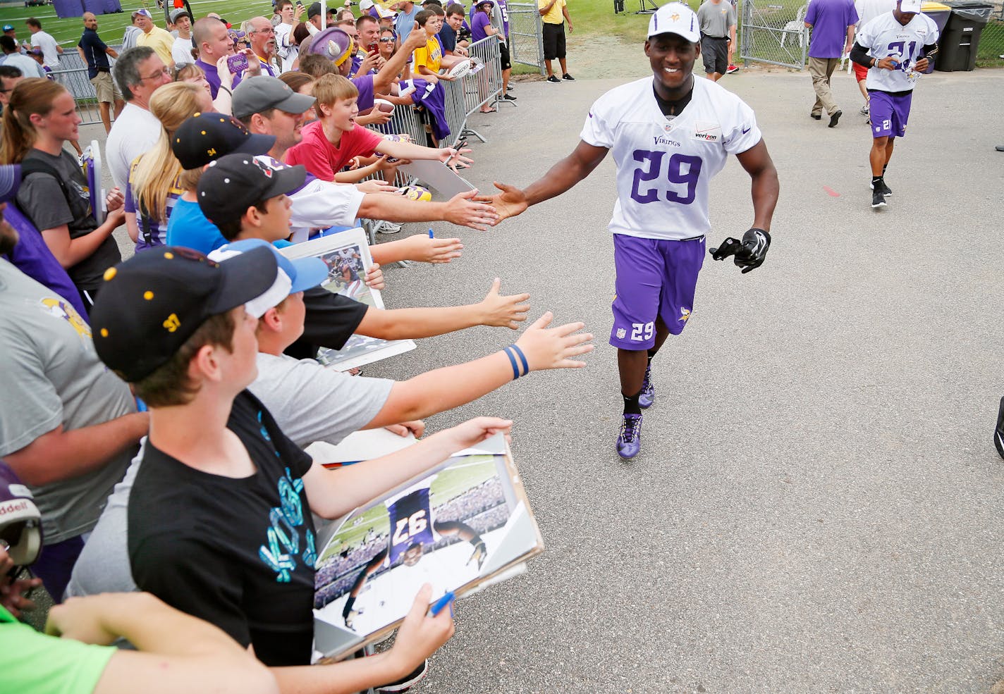 Vikings cornerback Xavier Rhodes slapped hands with fans at Vikings training camp. The Vikings are talking with MSU Mankato to extend their agreement to hold camp there.