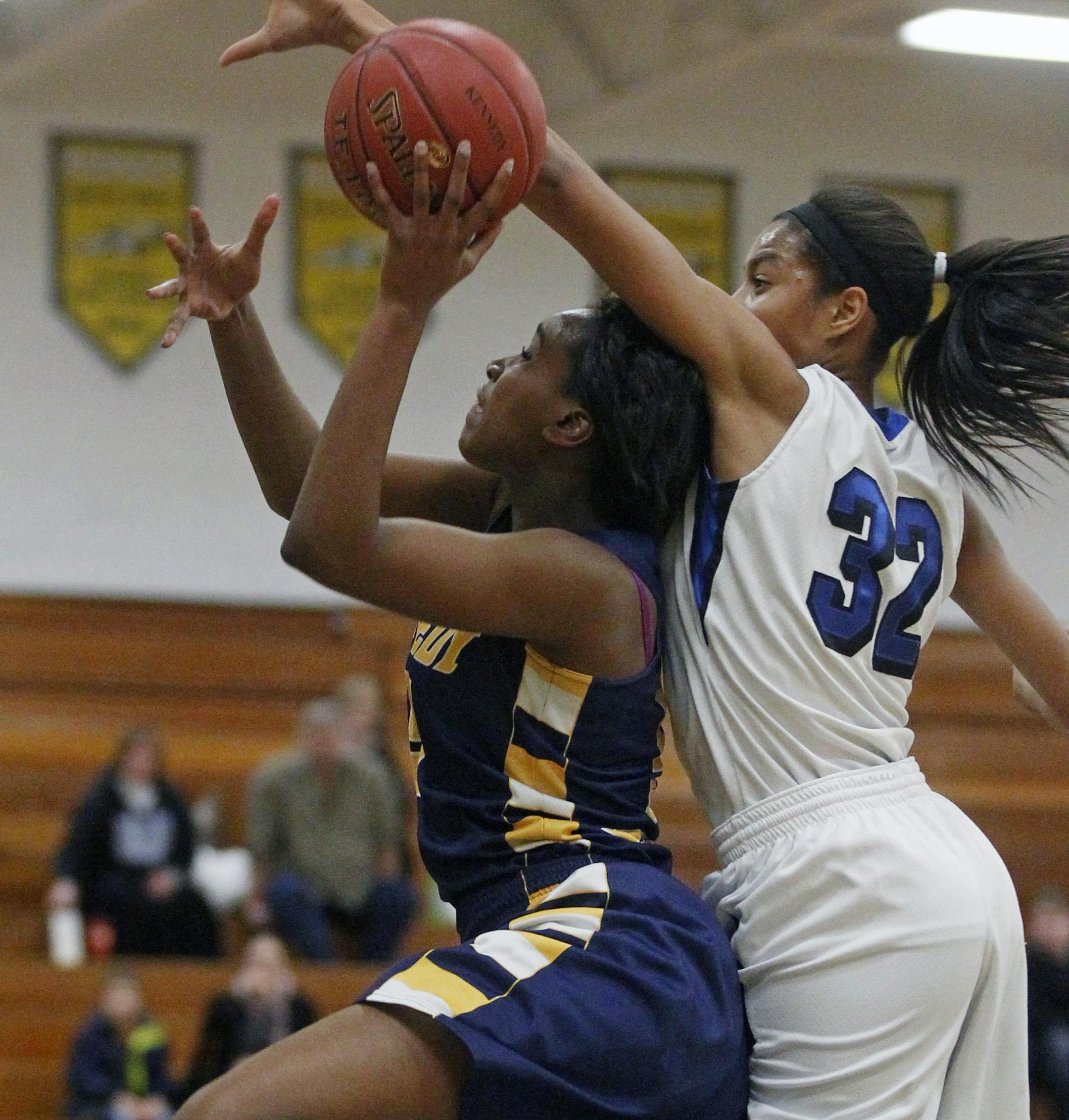At Bloomington Kennedy, in a game between Kennedy and Hopkins, Kennedy Tonoia Wade(5) gets defended by Hopkins' Nia Coffey(32) .] rtsong-taatarii@startribune.com ORG XMIT: MIN1211272154200801