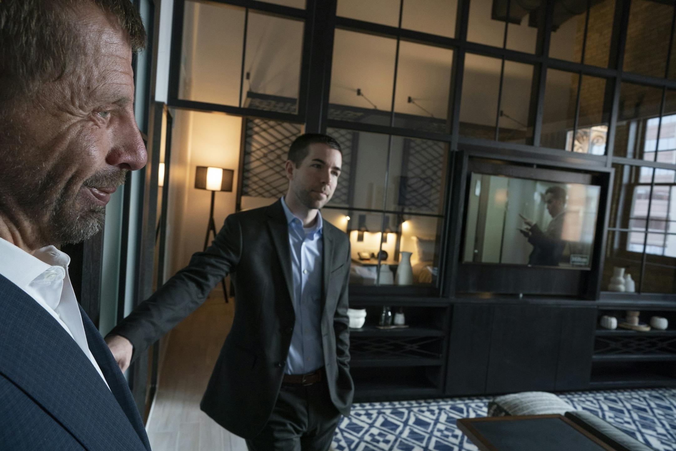 George Sherman, chief executive of Sherman Associates left and Shane LaFave, director of multifamily gave a tour of a room at the Canopy by Hilton at Thresher Square Monday February 25, 2019 in Minneapolis, MN.