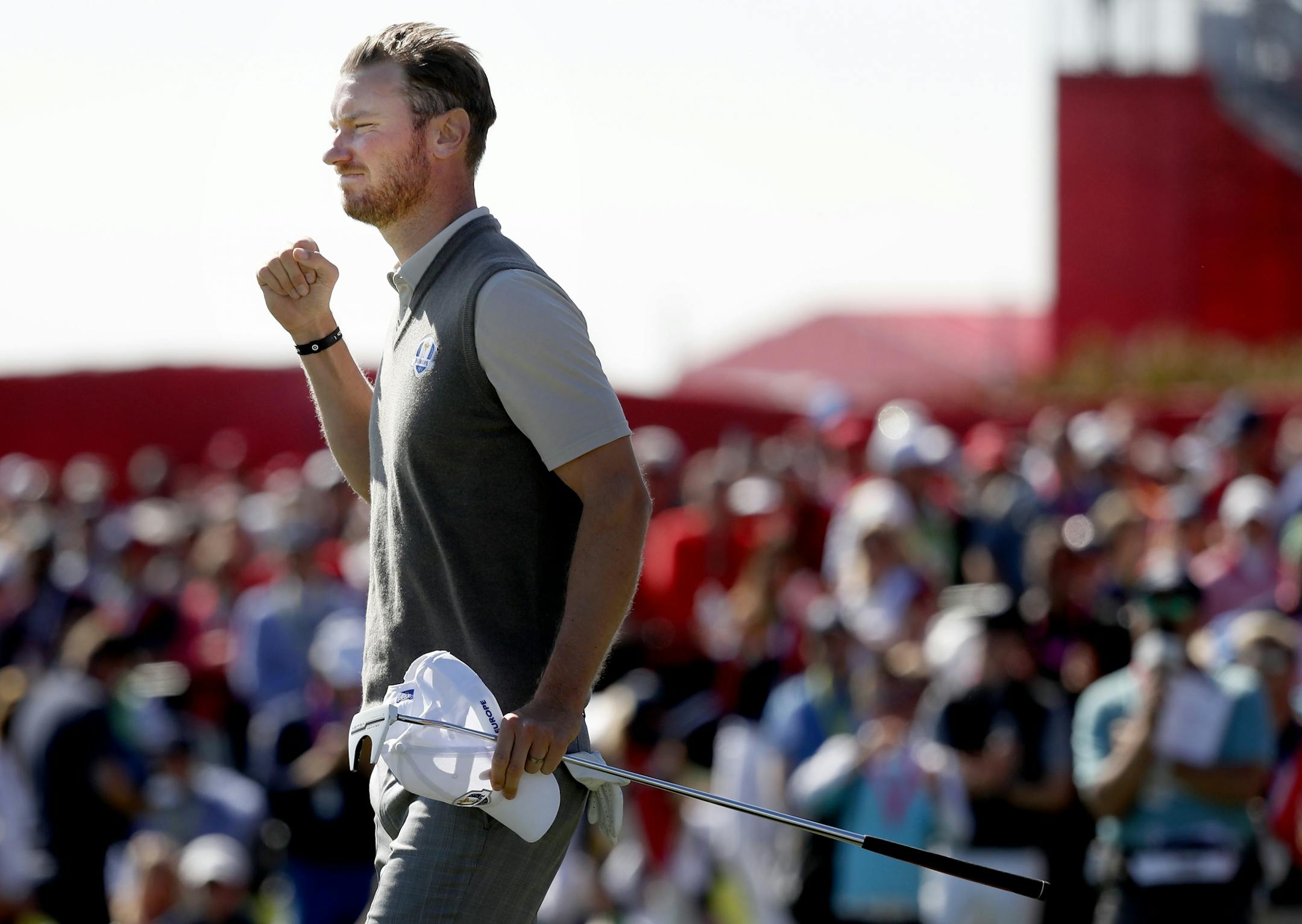 Chris Wood reacted after making a put on 18 during the morning session of the Ryder Cup on Saturday.