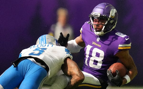 Vikings wide receiver Justin Jefferson was brought down by Detroit safety DeShon Elliott after catching a pass on Sept. 25.