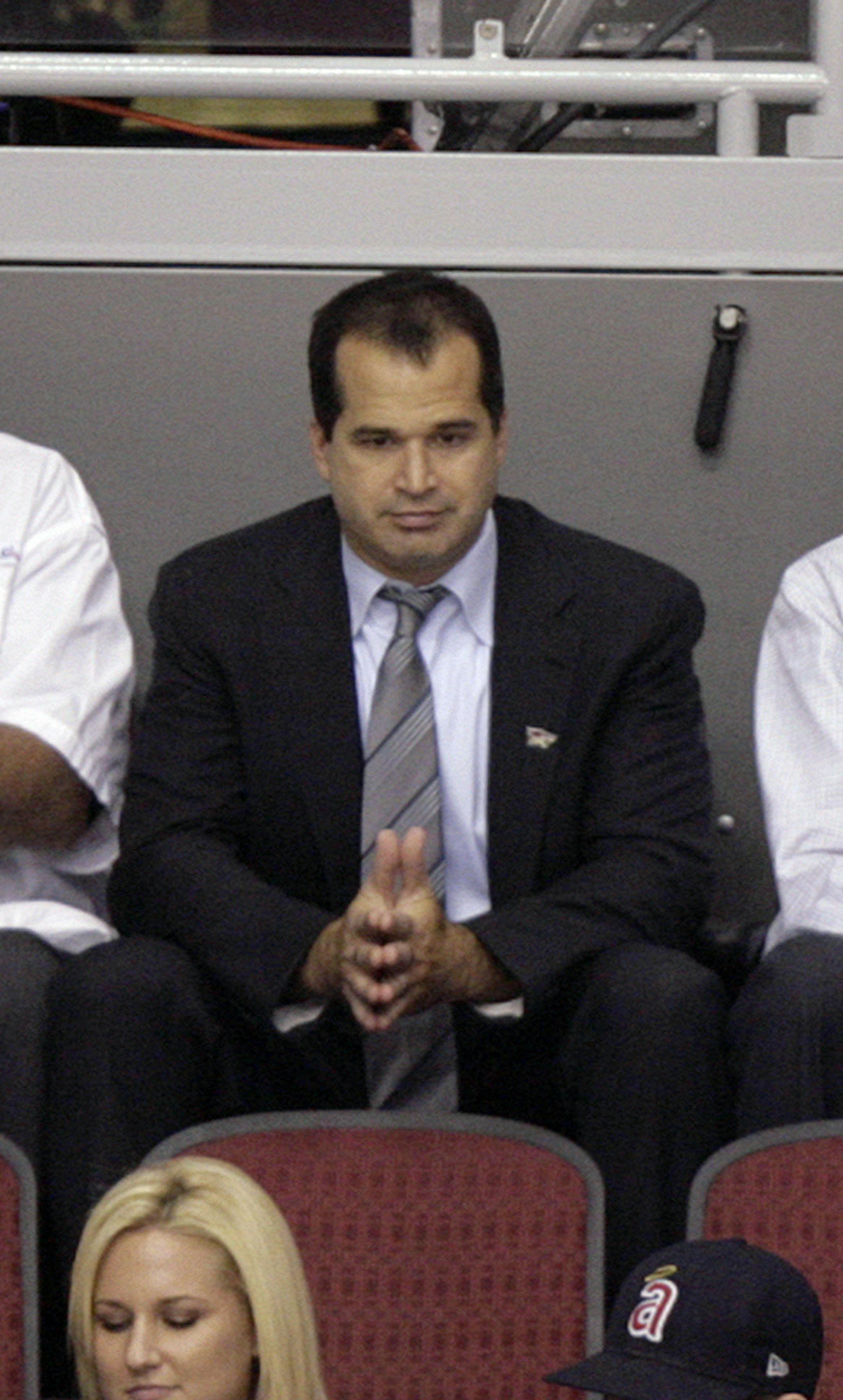 CEO of Peak6 Investments Matthew Hulsizer, top center, watches the action between the Detroit Red Wings and the Phoenix Coyotes in the first period of an NHL hockey game Saturday, Oct. 16, 2010, in Glendale, Ariz. The city of Glendale announced Friday that it has reached an agreement in principle with a group headed by Chicago investor Hulsizer on a new lease for the Coyotes. (AP Photo/Paul Connors) ORG XMIT: PNJ105