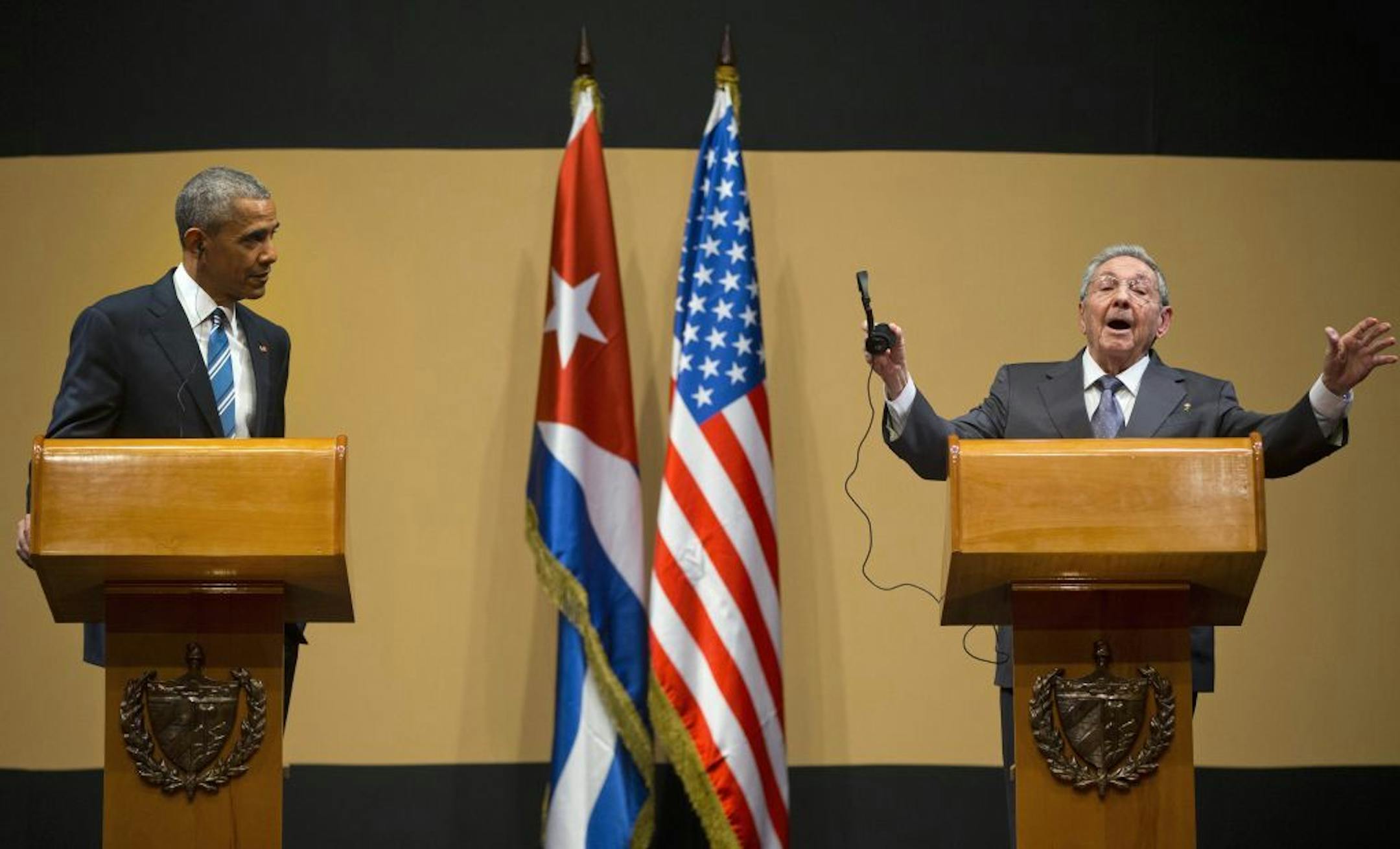 Cuban President Raul Castro gestures as he calls to an end his joint news conference with President Barack Obama at the Palace of the Revolution in Havana, Cuba, Monday, March 21, 2016. Obama's visit to Cuba is a crowning moment in his and Castro's bid to normalize ties between two countries that sit just 90 miles apart.