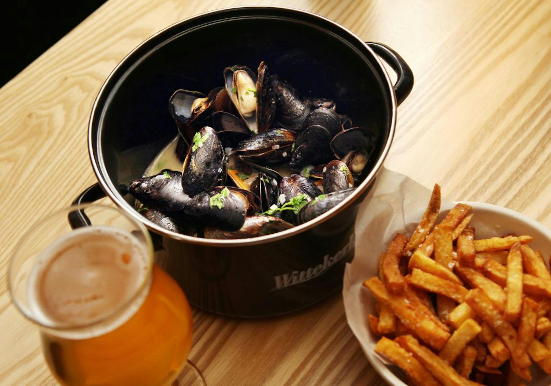 Moules Frites is mussels steamed with Wittekerke beer and bacon and served with fries at Pig & Fiddle.